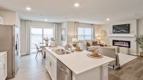 Open concept kitchen overlooking dining area and living room