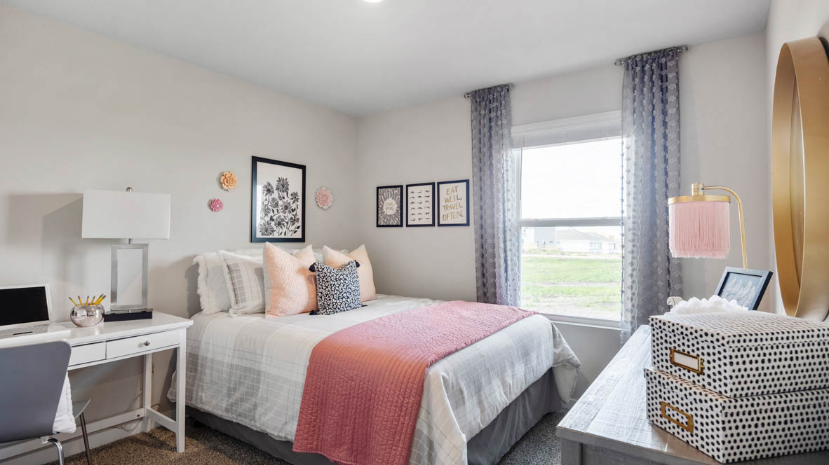 First bedroom with window and overhead lighting