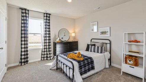 Third bedroom with twin bed and small window
