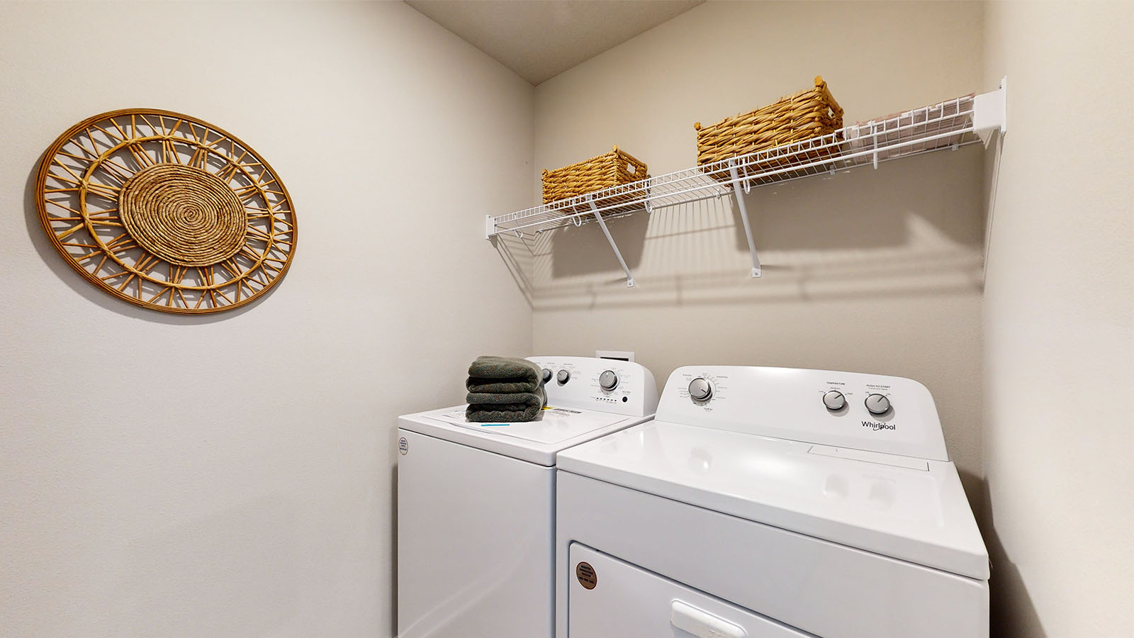 Laundry room with washer and dryer and shelving
