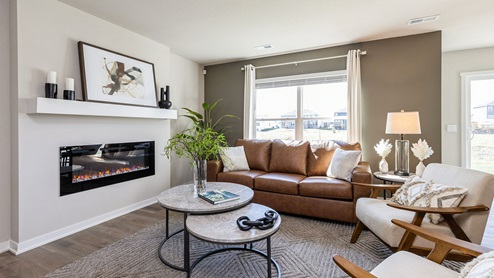 Cozy living room with large window and electric fireplace