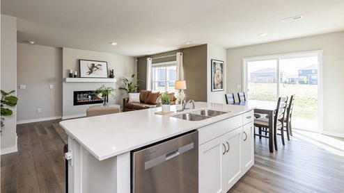 Kitchen island overlooking living room and dining area