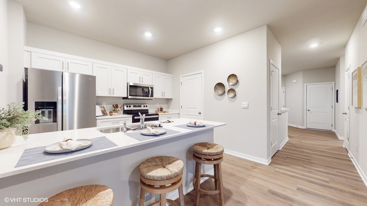 Kitchen with island and wooden barstools