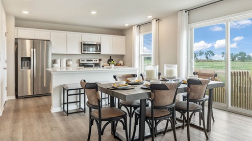 dining area next to sliding glass doors and patio