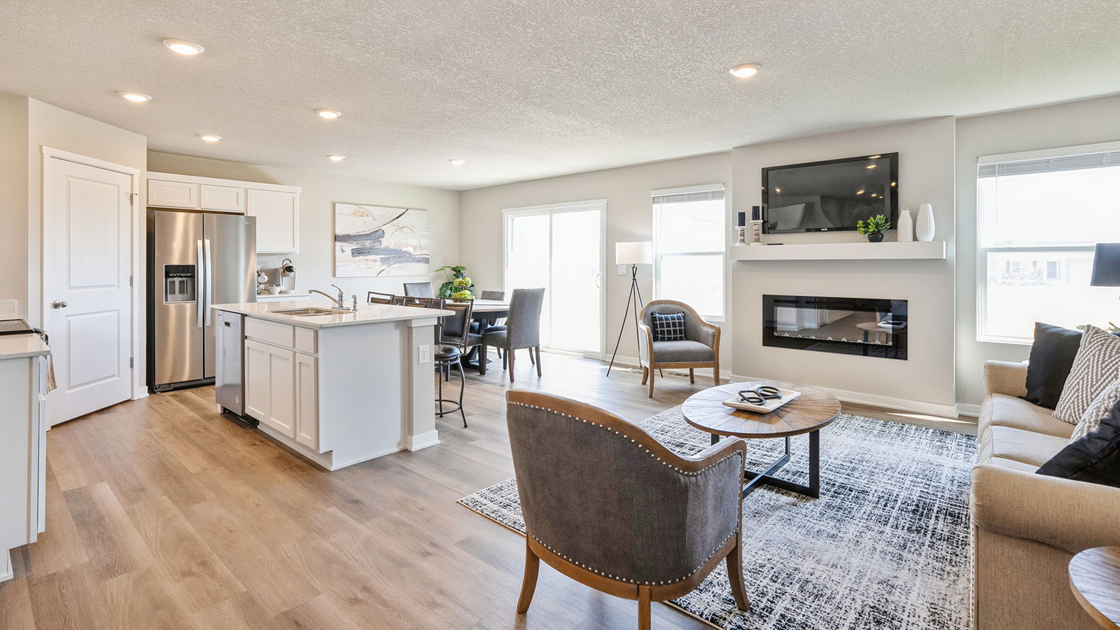 Open concept floorplan with view of kitchen, living room, and dining area.