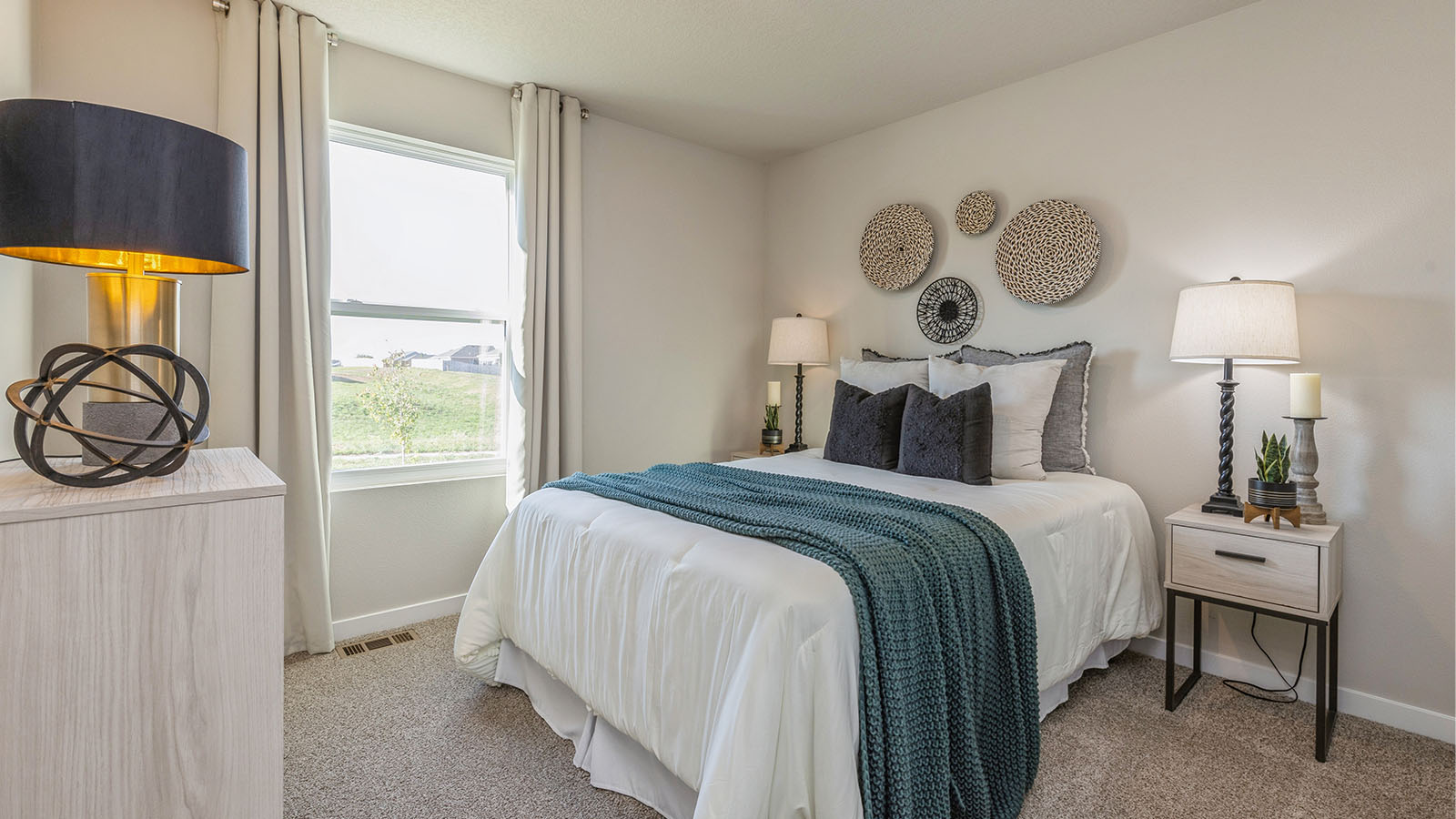 Bedroom with carpeted floors and a window.