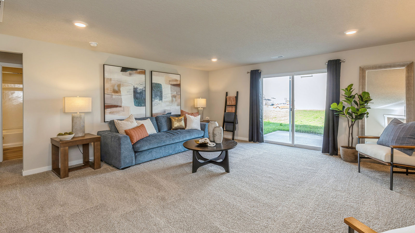 Finished basement with carpeted floors.