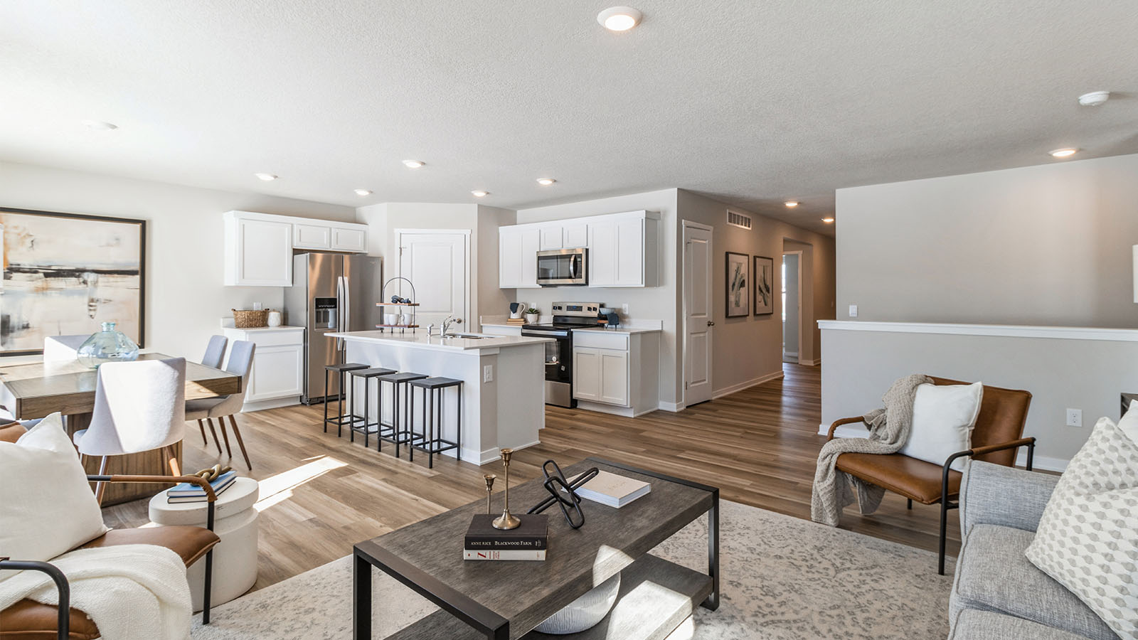 View of dining area and modern kitchen from the living room
