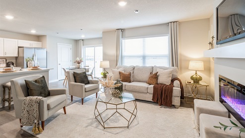 large living room with white seating and white area rug