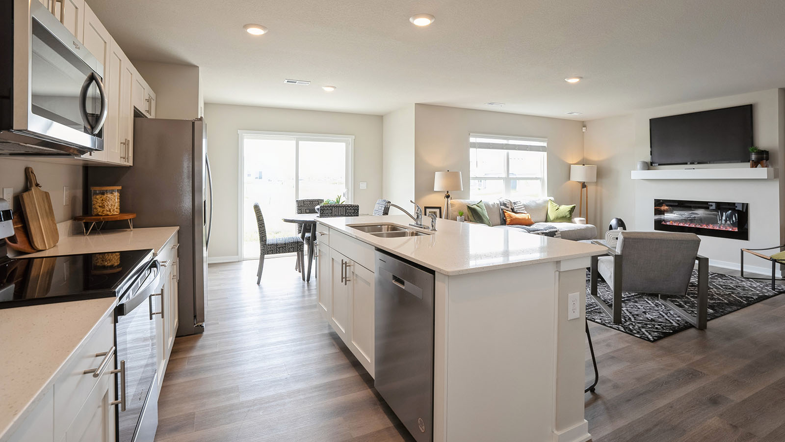 Open concept kitchen overlooking dining area and living room