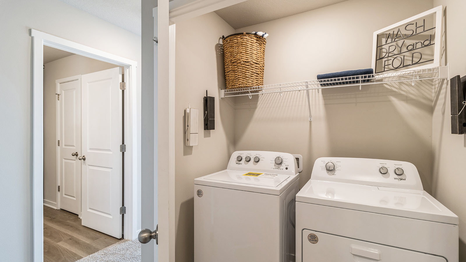Laundry room with built in shelving.