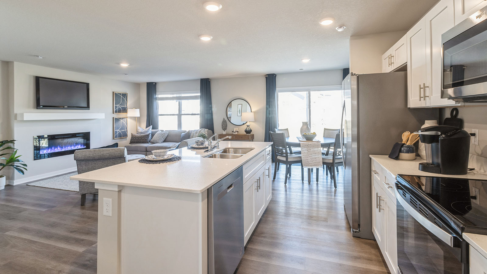 Open view of kitchen and living room.