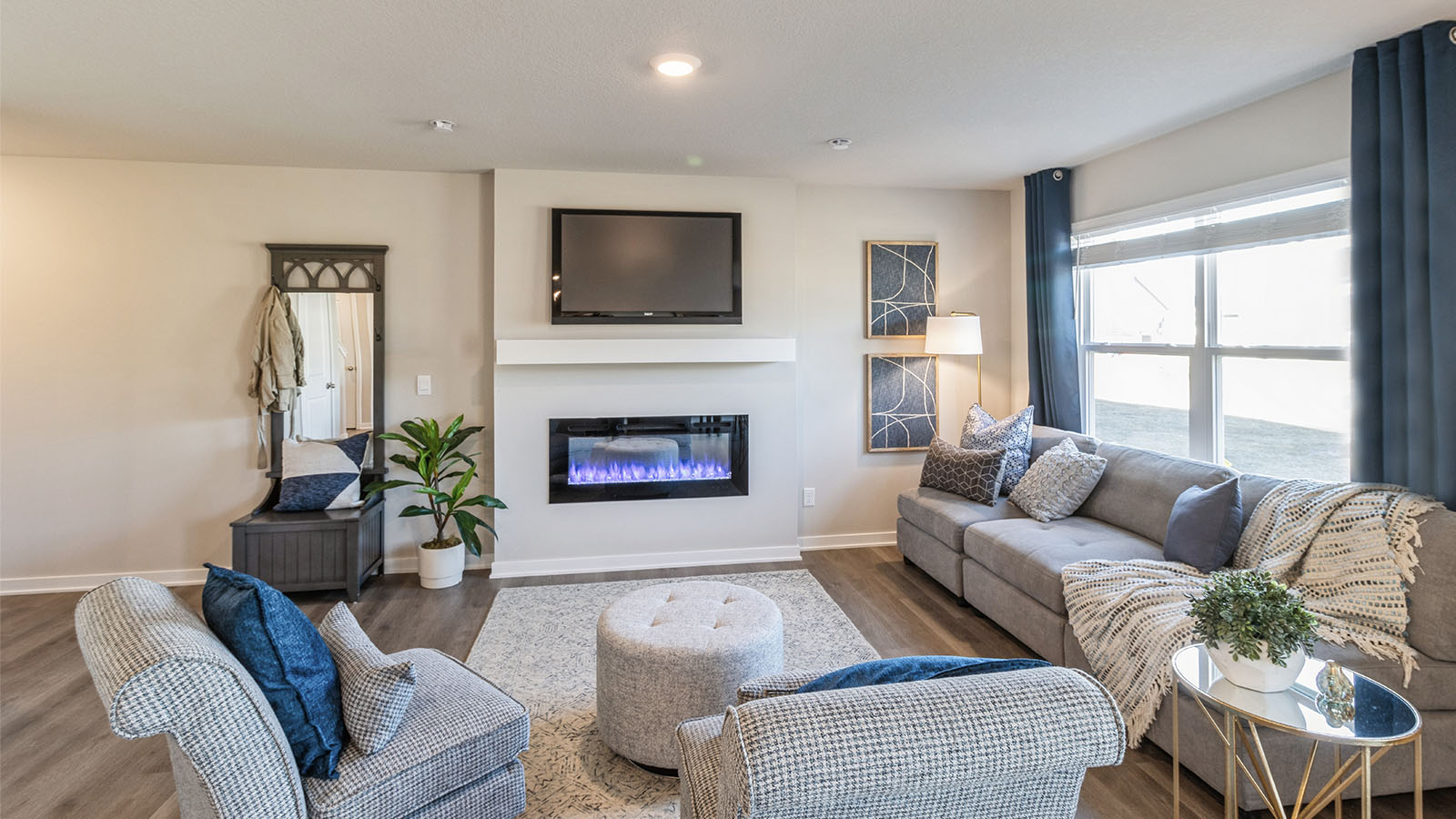 Spacious living room with large window for natural lighting.