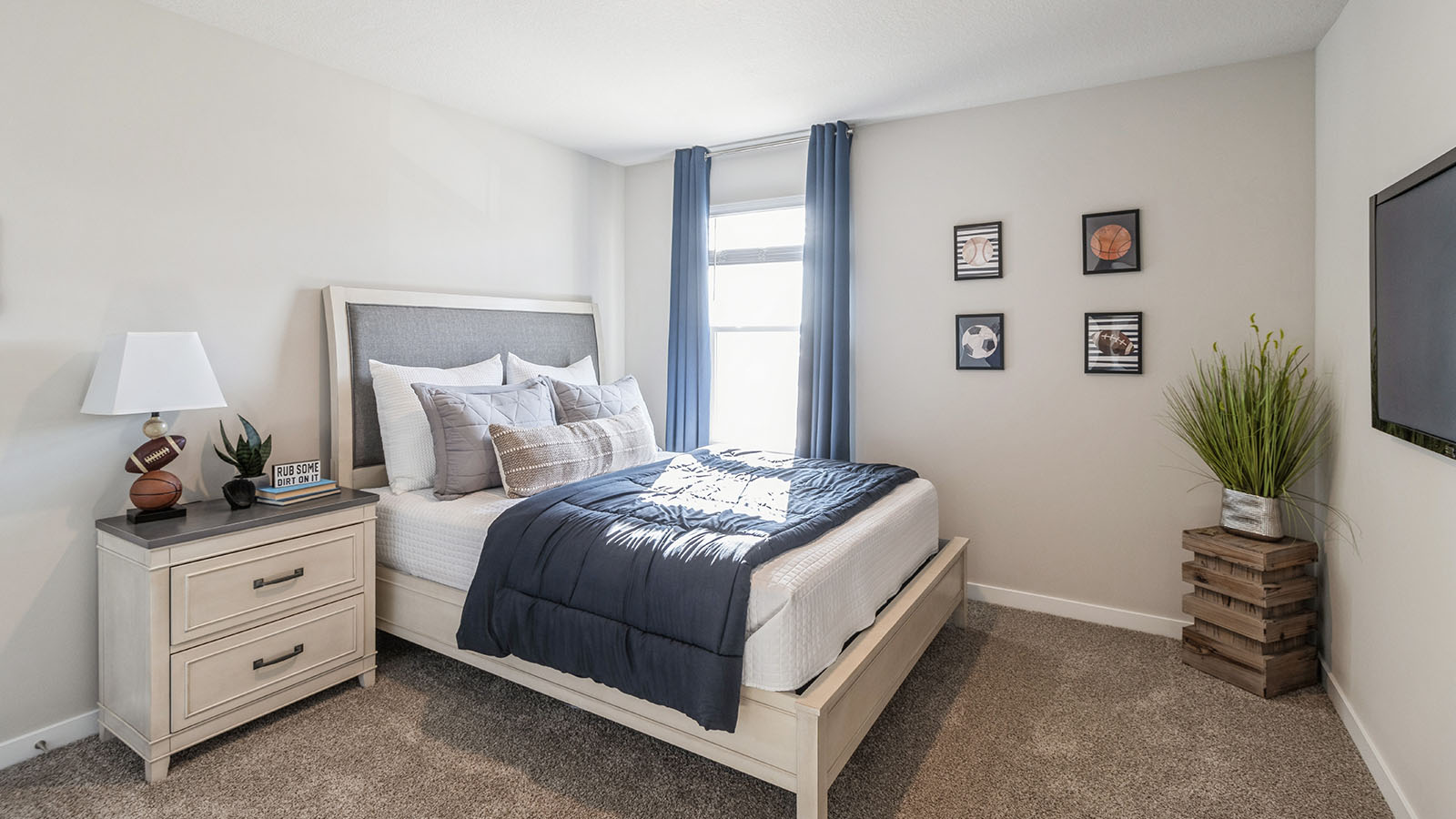 Bedroom with carpeted floors and a window.