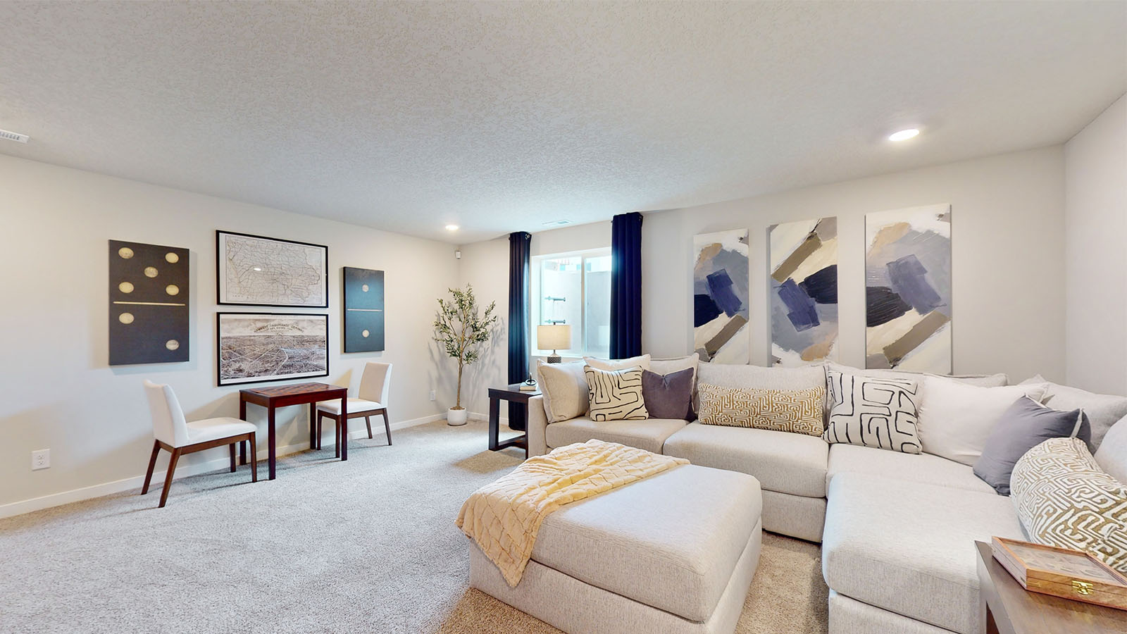 Finished basement with large white sectional