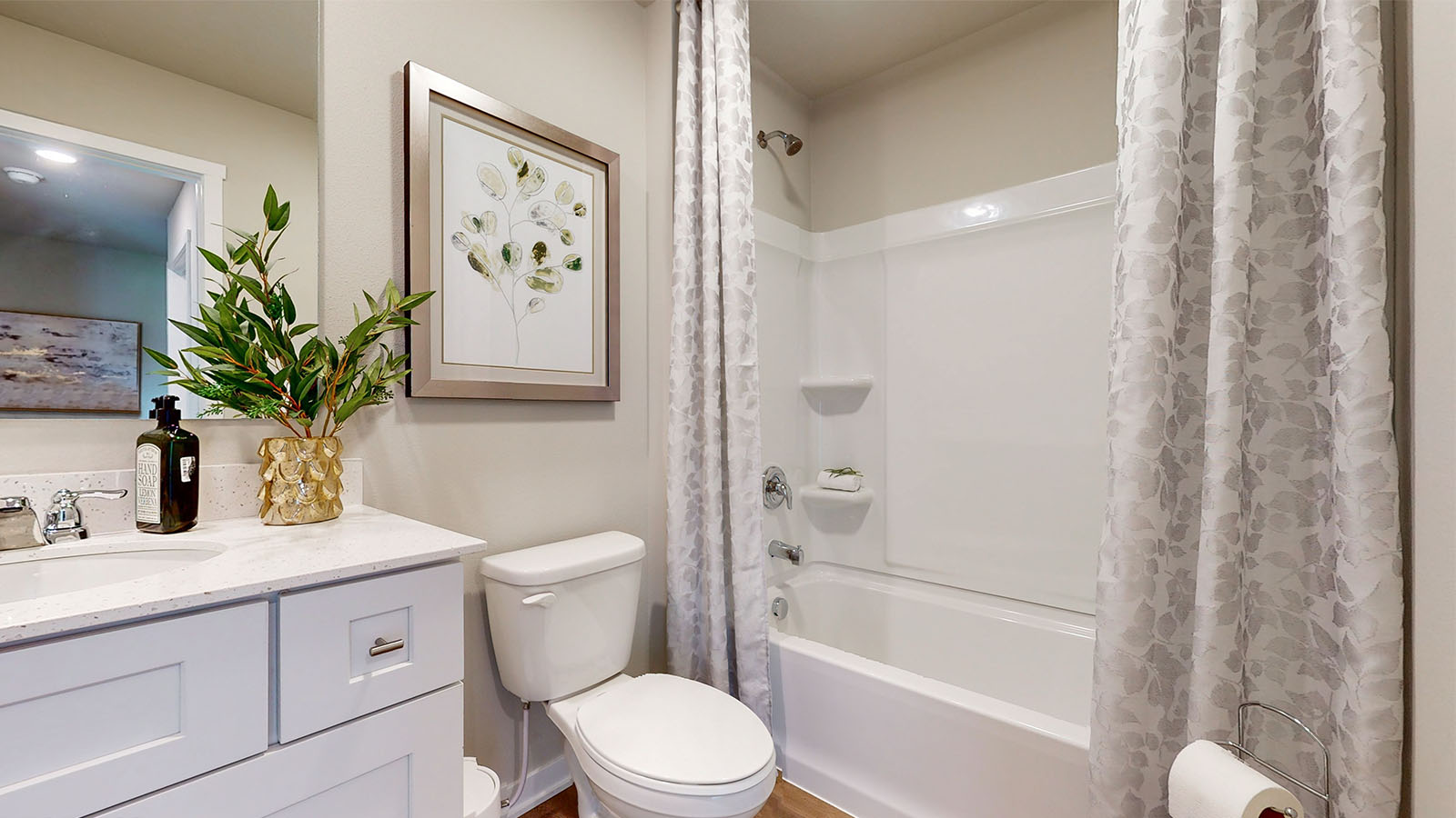 Bathroom with single sink and step in shower.
