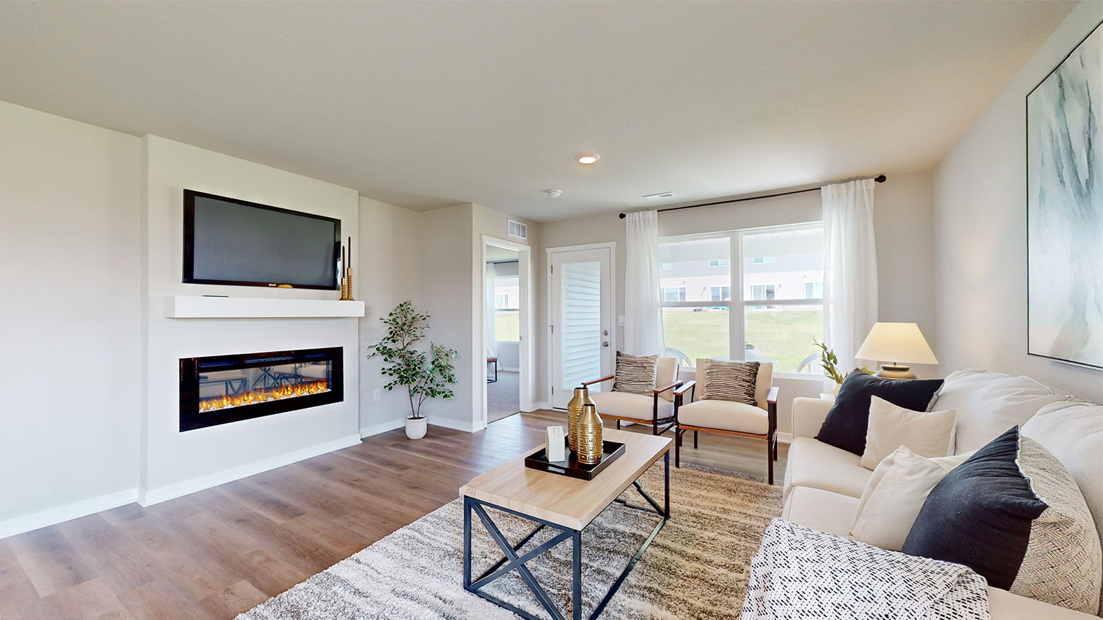 Living room with electric fireplace.