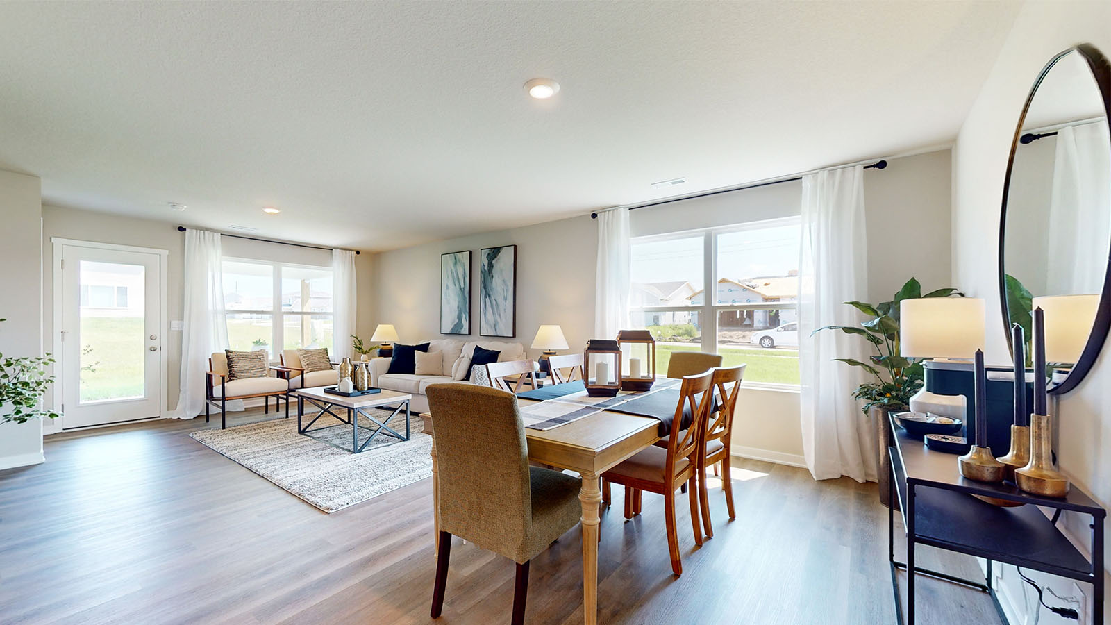 Dining area with large window for natural lighting.