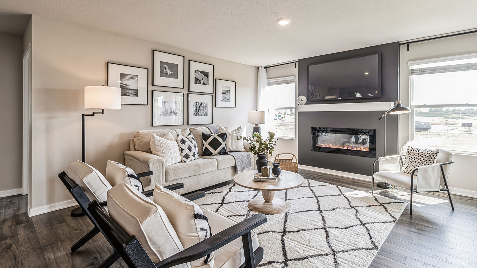 Living room with fireplace showcasing open concept connections to kitchen and dining areas Three Lakes
