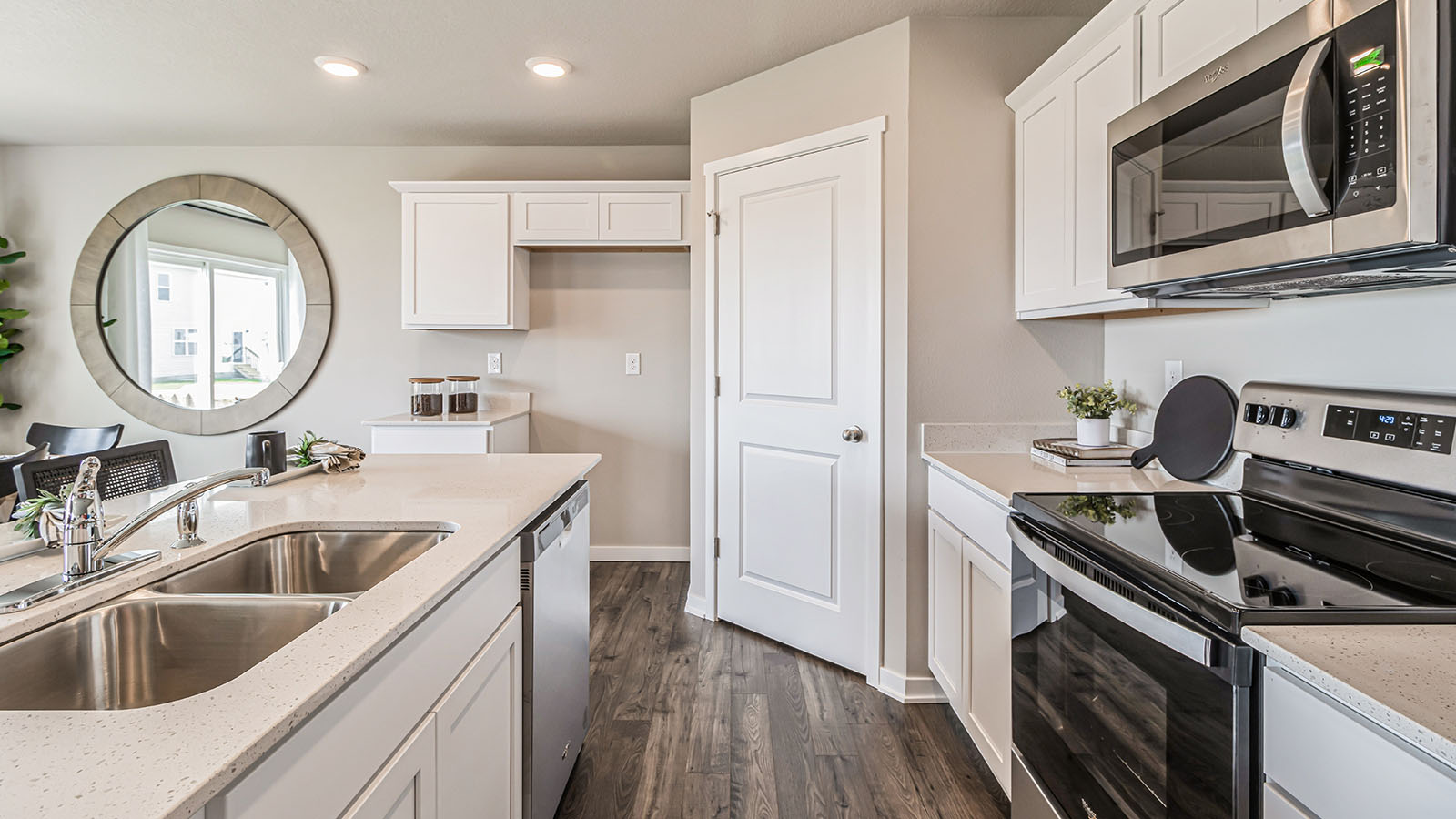 Side view of kitchen island showing seating, sink placement, prep zones, appliance suite included Three Lakes