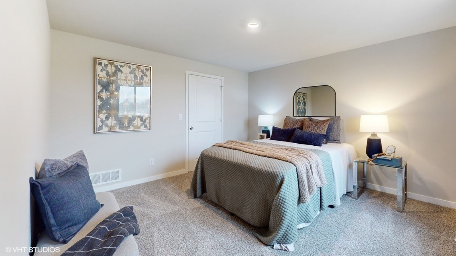 Fourth bedroom in basement with bed and bench for seating