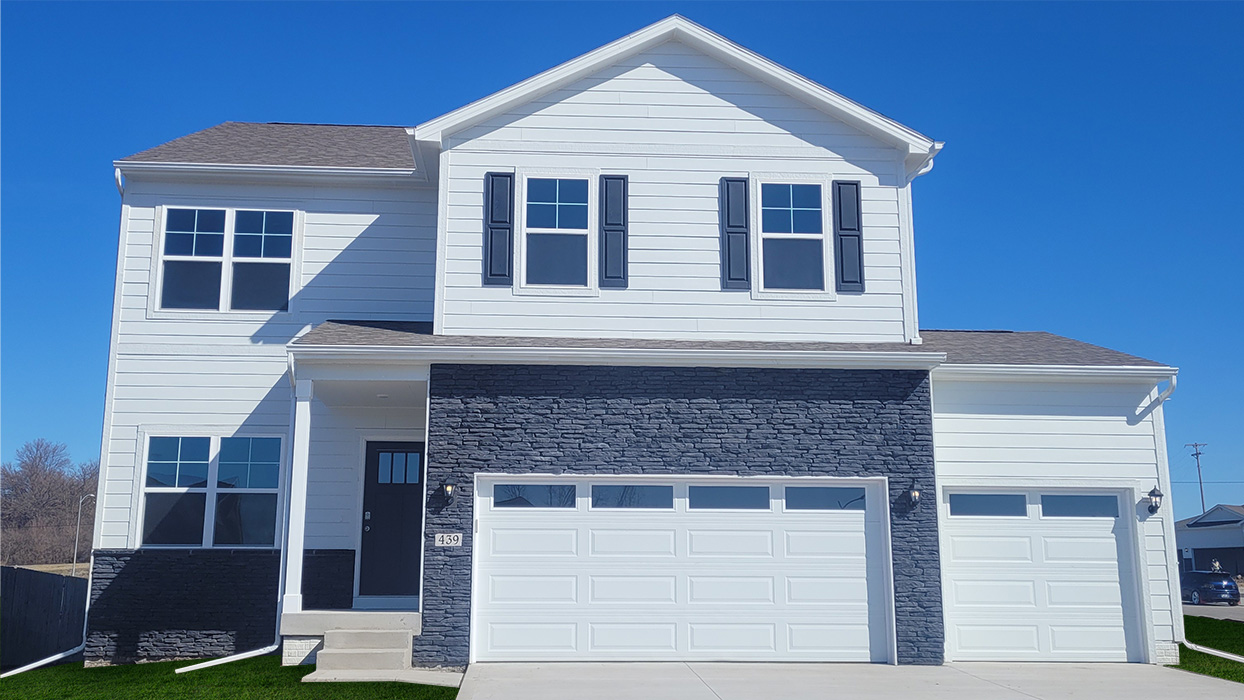 The exterior of a two-story home with a two-car garage