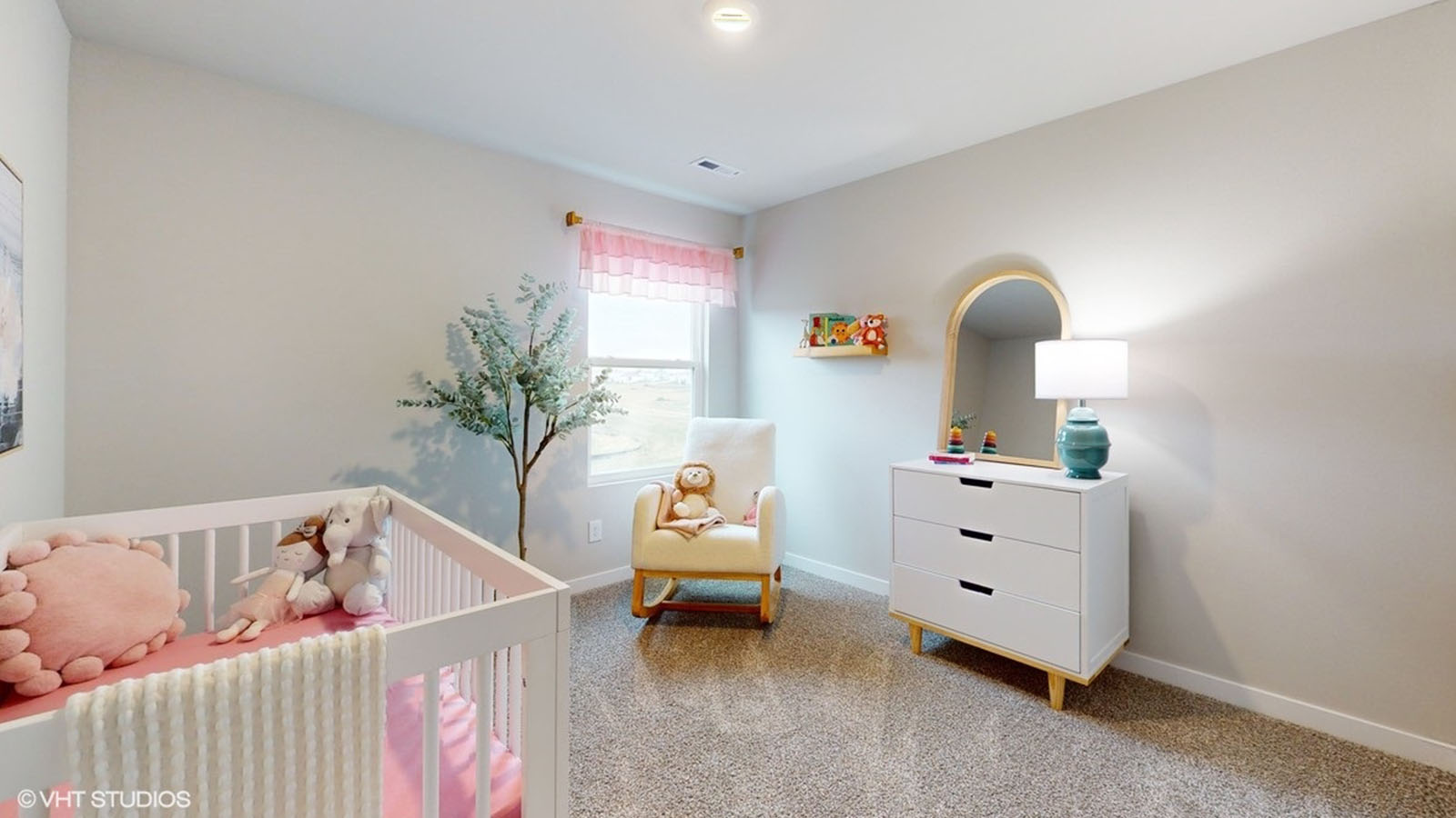 Bedroom with a small window and carpeted floors.
