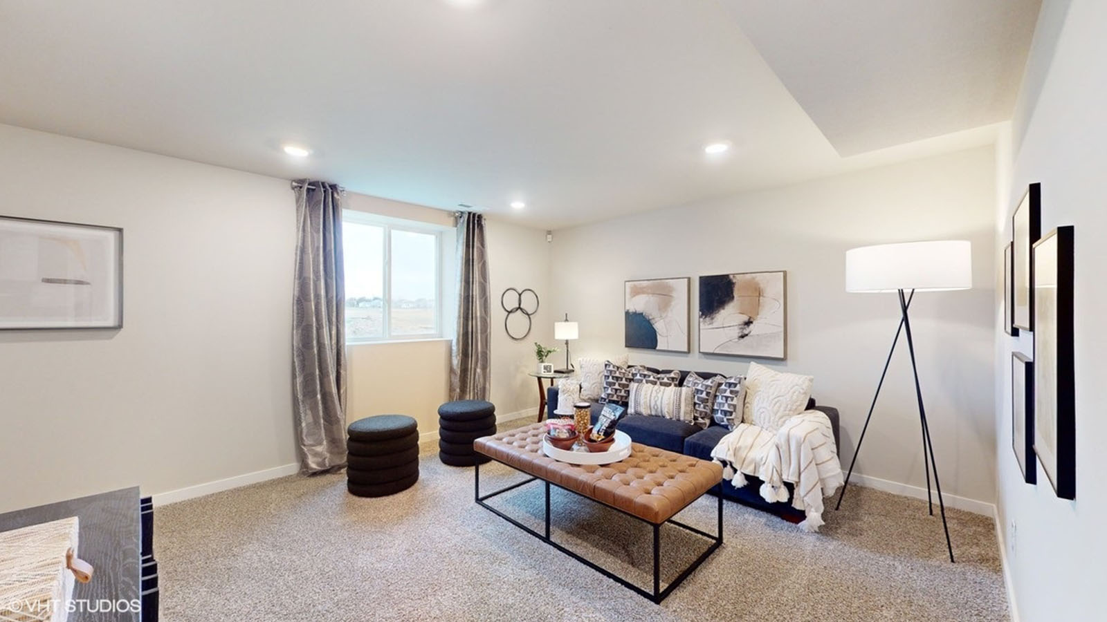 finished basement with egress window and couch with coffee table