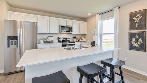 modern kitchen with small window and island