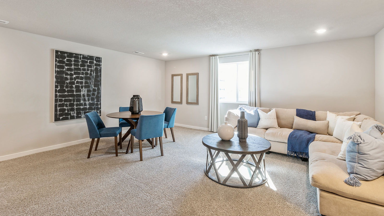 Spacious finished basement with egress window and large white sectional