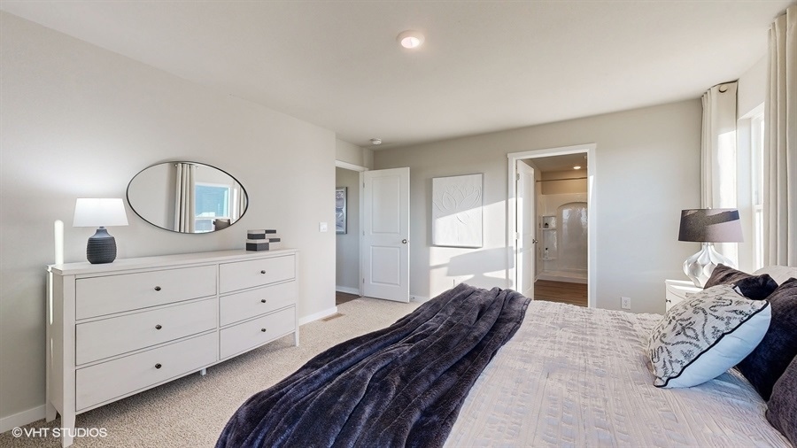 Owner’s suite offers natural window light, spa-inspired ensuite bathroom, backyard view, walk-in closet for everyday style