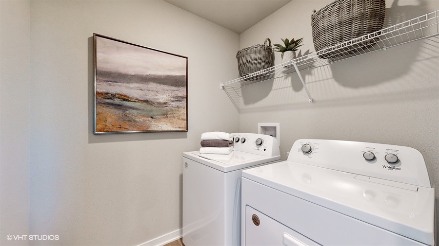 Neuville laundry room with shelves
