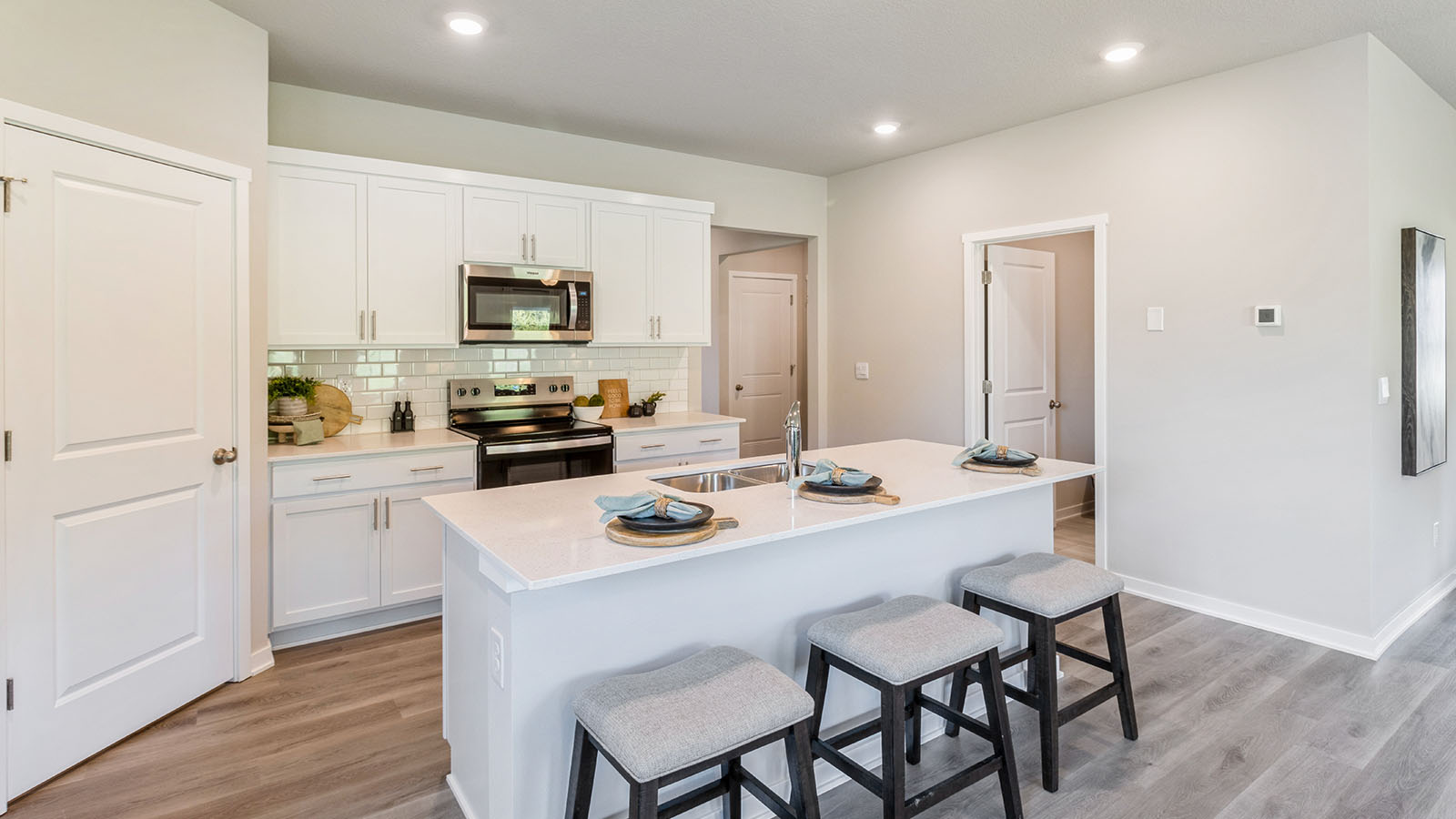 Kitchen with walk-in pantry and stainless-steel appliances