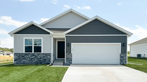 front exterior of Aldridge home with 2 car attached garage