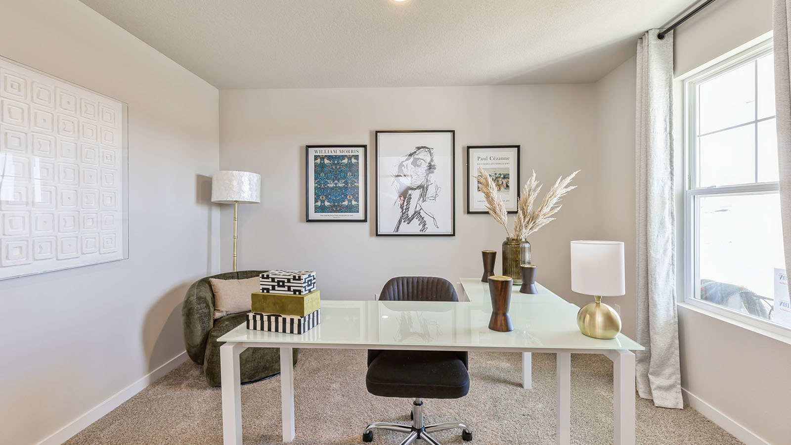 Front office with white desk and black chair next to large window