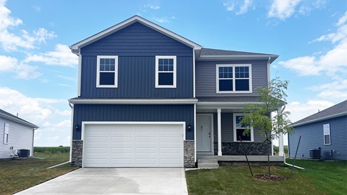 front exterior of bellhaven home with two 2 car attached garage