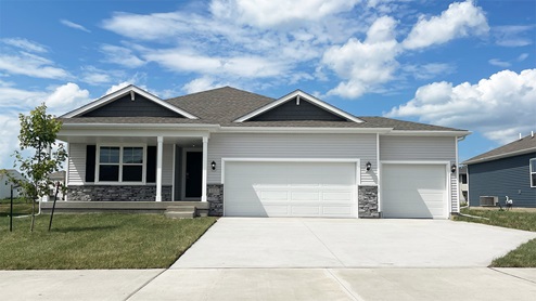 front exterior of hamilton home with attached 3 car garage