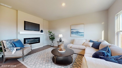 Cozy living room with electric fireplace and mounted tv