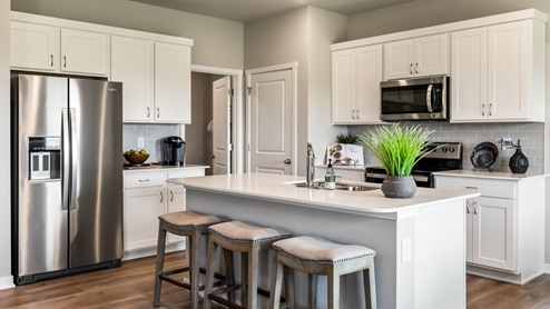 Kitchen with stainless-steel appliances and white cabinets
