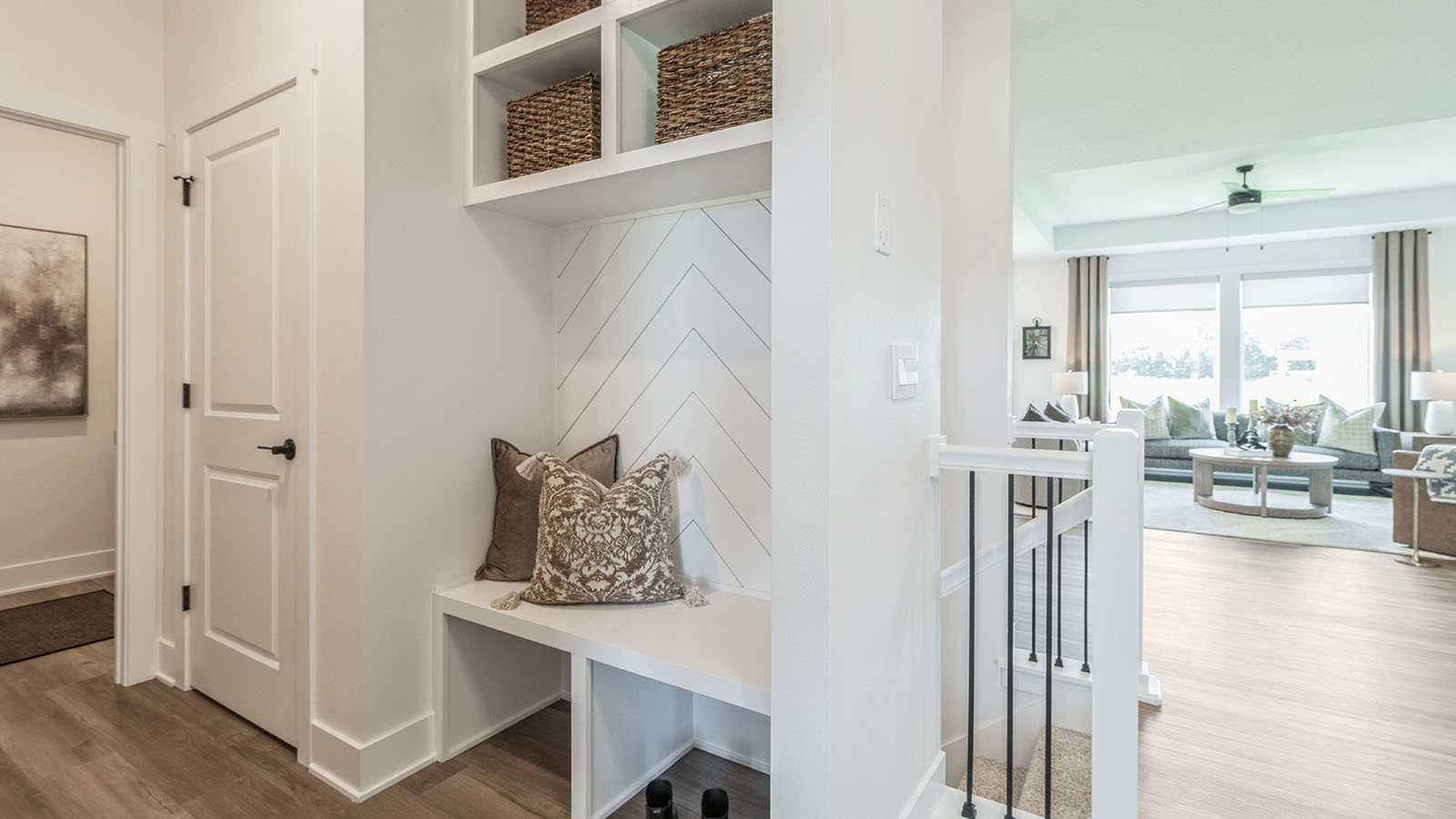 Front entryway with locker and cubbies for storage next to closet