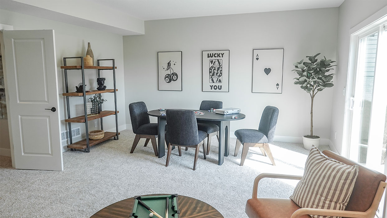 spacious flex room with a couch and game table