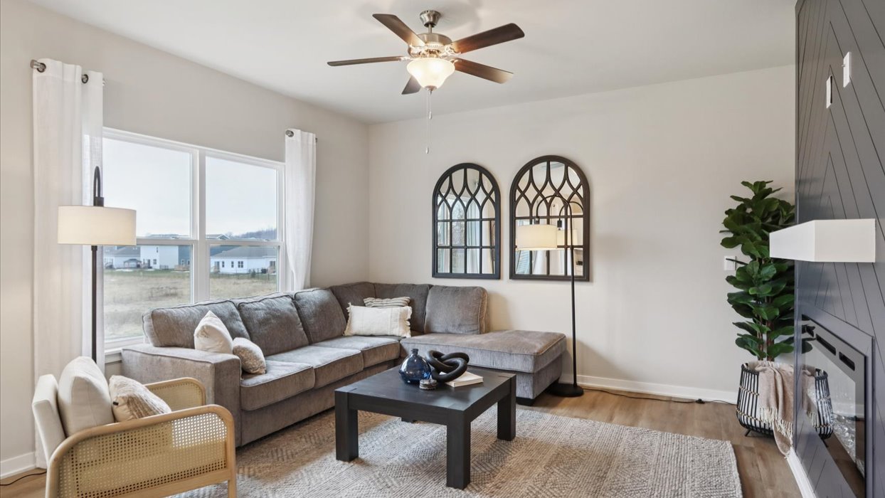 bellhaven living room with large window and ceiling fan