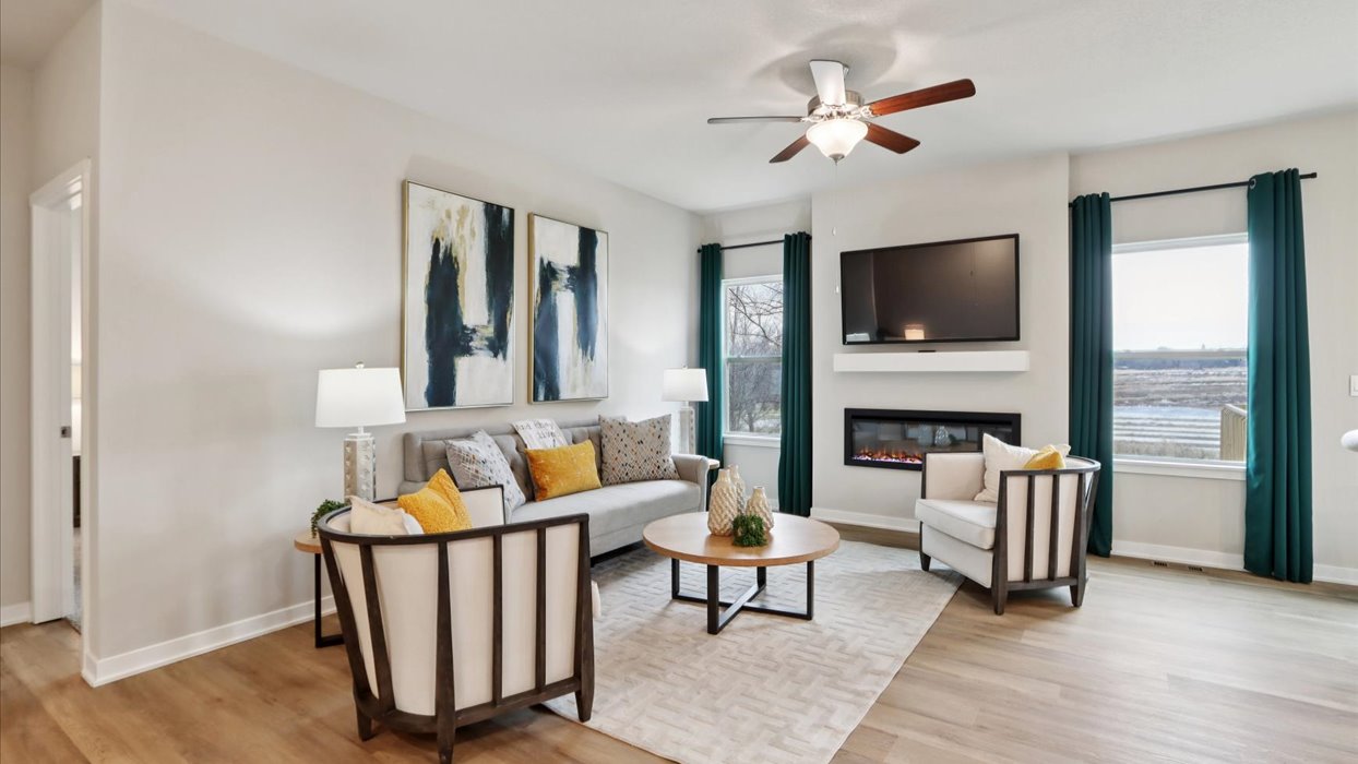 colorful hamilton living room with two small windows and ceiling fan