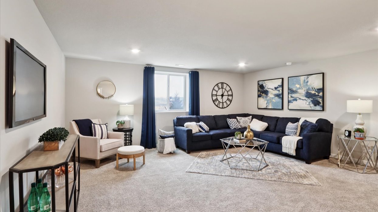 Finished basement living area with comfortable seating space and flexible room for entertaining or relaxing.