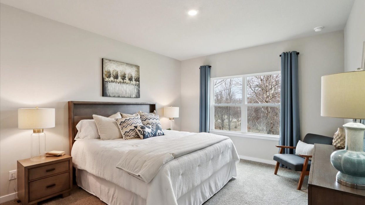 Primary bedroom with natural lighting and spacious layout