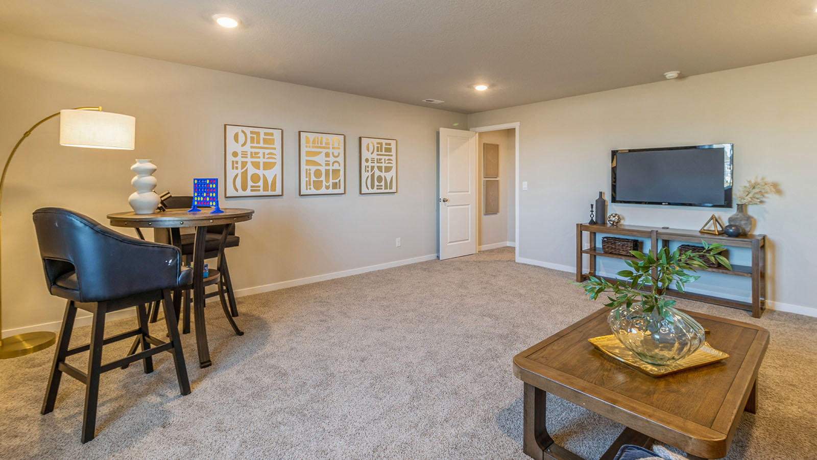 Finished basement living area with comfortable seating space and flexible room for entertaining or relaxing.