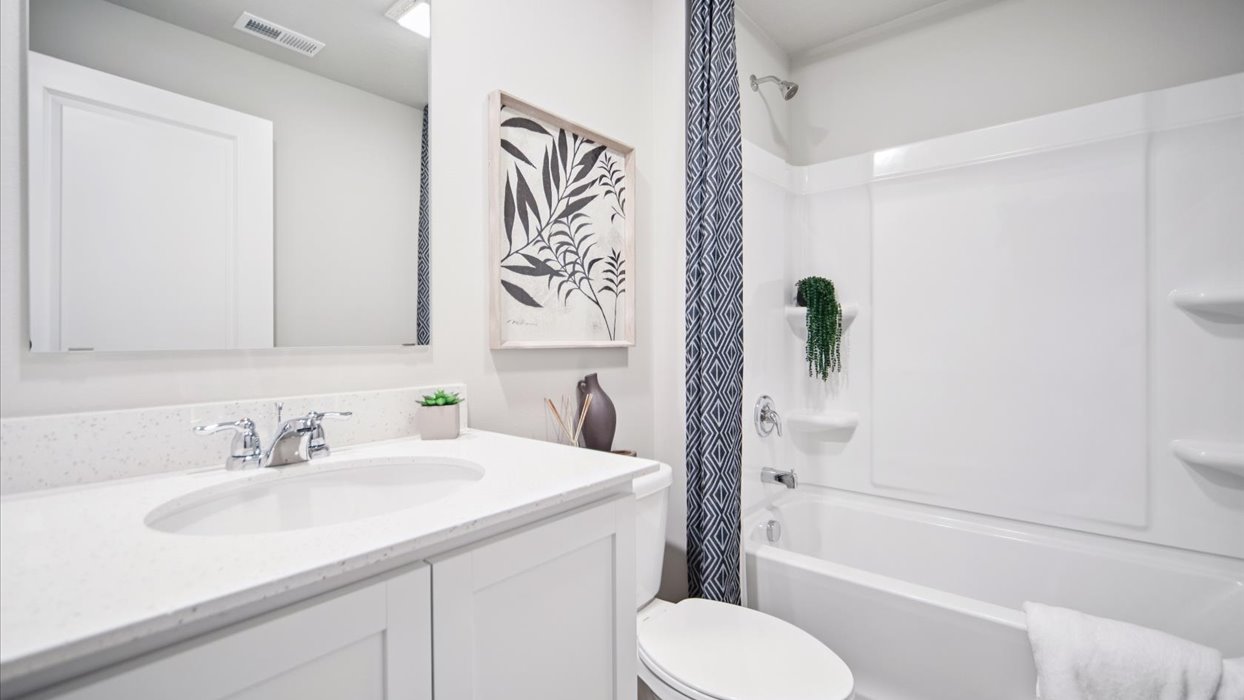Stylish lower-level bathroom featuring contemporary fixtures and convenient access from the finished basement.