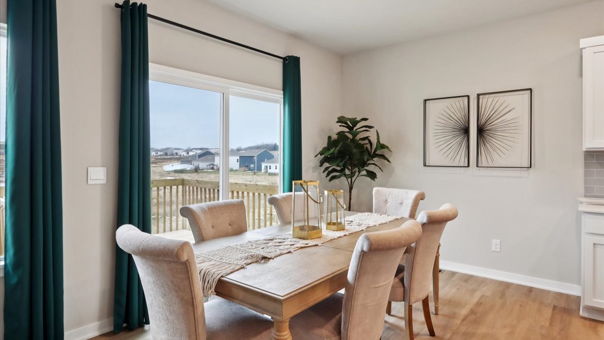 Open concept dining space with access to backyard
