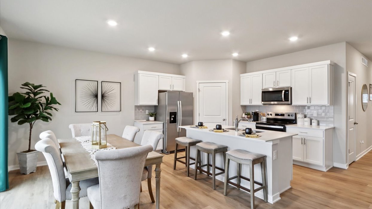 Kitchen with white cabinetry and quartz countertop