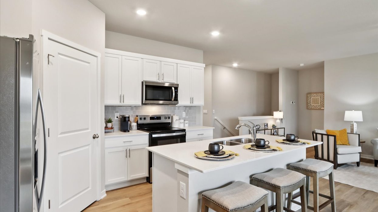 Kitchen with white cabinetry and quartz countertop